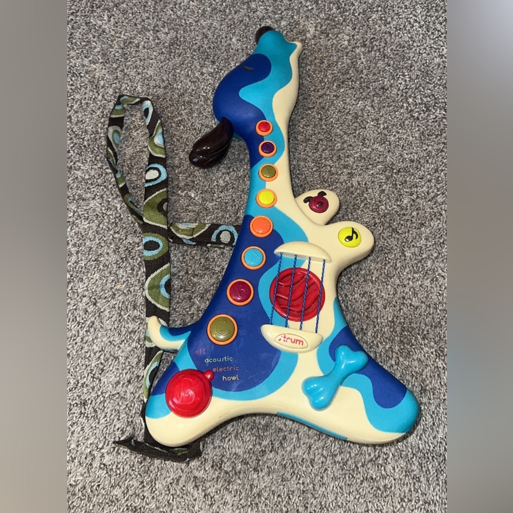 B. Toys B. Woofer Guitar